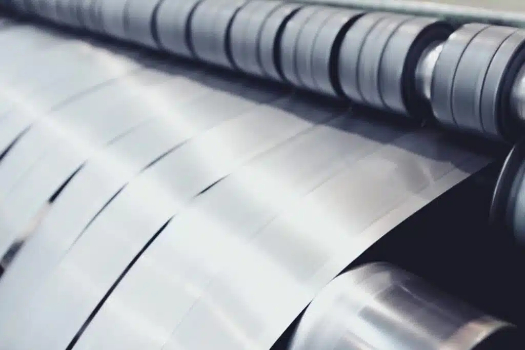Steel strip coils being slit to width