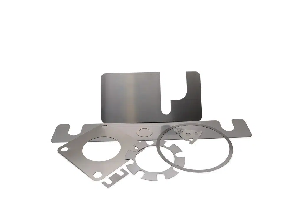 Custom metal shims cut to bespoke profiles