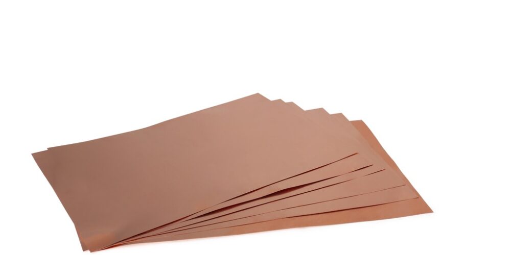 Copper shim sheets laid out in a fan