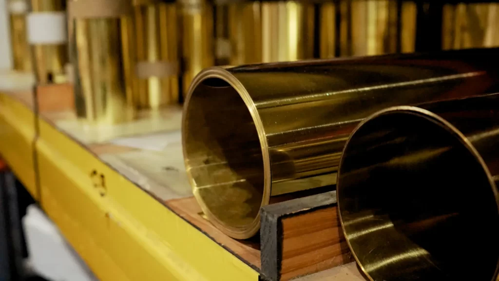 Brass shim stock rolls on warehouse racking